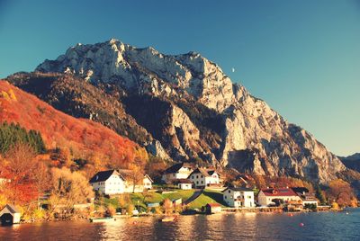 Scenic view of sea and mountain against sky