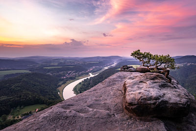 Scenic view of mountains against sky during sunset