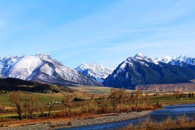 View of snowcapped mountain against blue sky