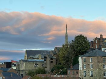 Buildings in city against sky