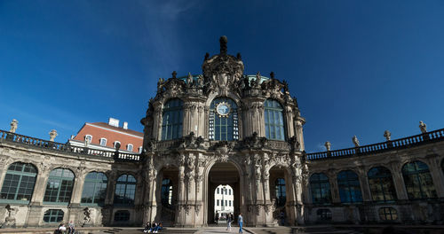 Low angle view of historical building against blue sky