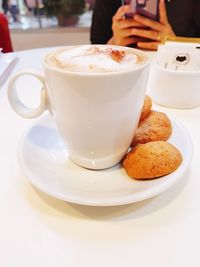 Close-up of coffee cup on table