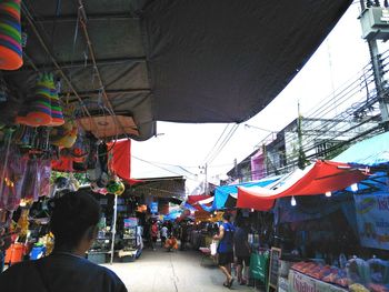 People at market stall in city