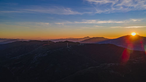 Scenic view of mountains against sky during sunset