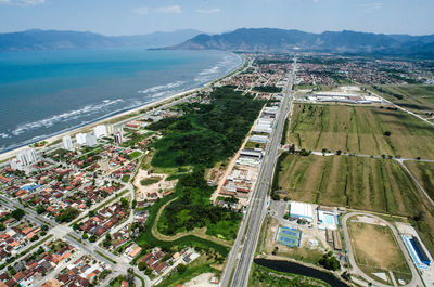 High angle view of city by sea