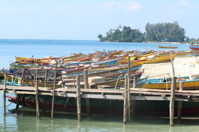 Boats in sea against sky