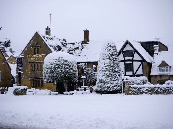 SNOW COVERED HOUSES AGAINST CLEAR SKY