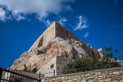 Low angle view of castle against blue sky