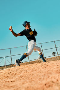 Low angle view of man playing soccer