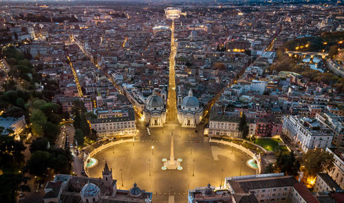 High angle view of illuminated buildings in city