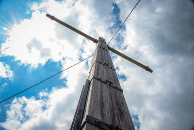 Low angle view of wind turbine against sky