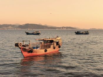 Scenic view of sea against clear sky during sunset