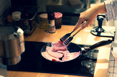 Close-up of man preparing food in kitchen