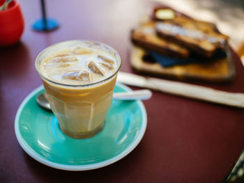 Close-up of cappuccino served on table