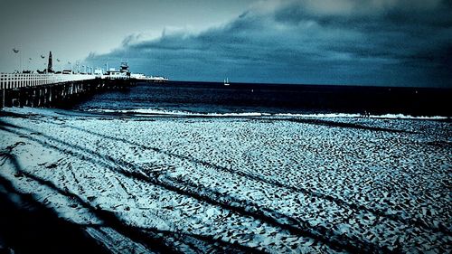 Scenic view of sea against cloudy sky
