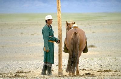 Rear view of men on field