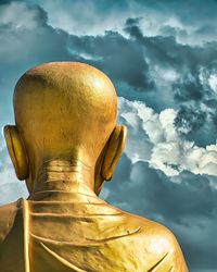 Low angle view of statue against sky