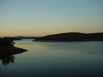 Scenic view of sea against clear sky during sunset