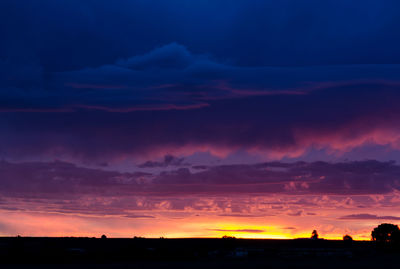 Scenic view of silhouette landscape against romantic sky at sunset