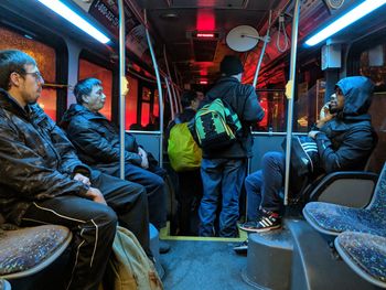 People sitting in train at night