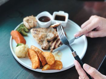 High angle view of person having breakfast on table