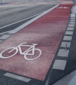 High angle view of road sign on street in city