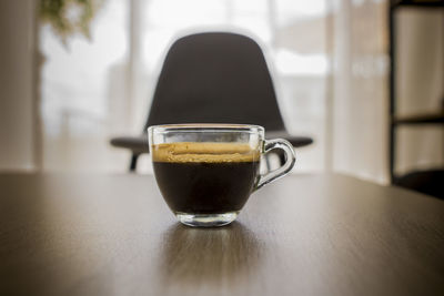 Close-up of coffee in cup on table