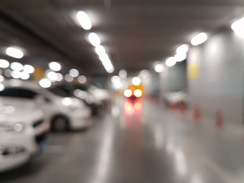 Defocused image of illuminated lights on city street