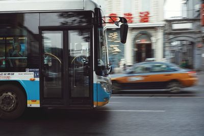 Blurred motion of land vehicles moving on city street