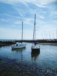 Boats sailing in sea