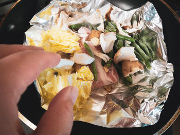 High angle view of hand holding food