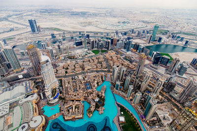 High angle view of river amidst buildings in city