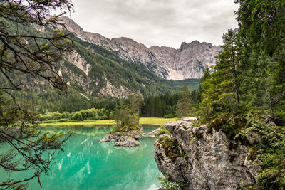 Scenic view of lake and mountains against sky