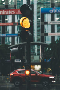 Traffic signal on road in city