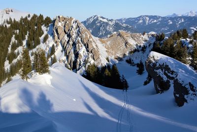 Scenic view of snowcapped mountains against sky