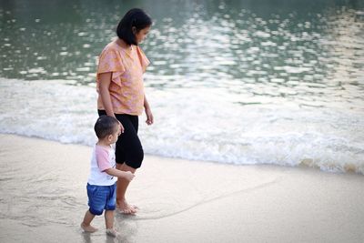 Full length of woman walking on beach