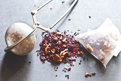 Tea infuser with dried flowers on table