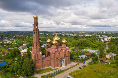 High angle view of trees and buildings against sky