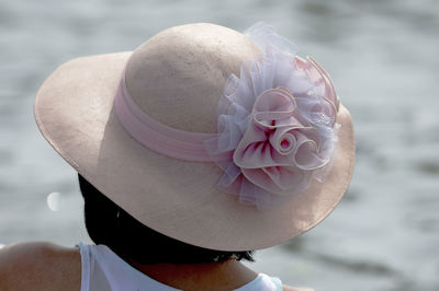 Close-up portrait of woman with hat in sea