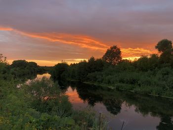 Scenic view of lake against sky during sunset