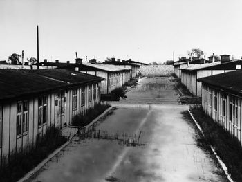Street amidst buildings against clear sky