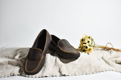 Close-up of shoes against white background