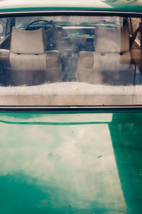 Reflection of people on swimming pool