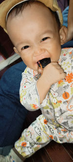 Portrait of cute baby girl at home