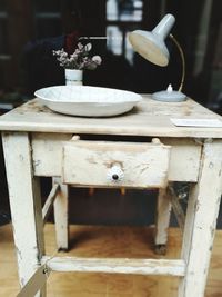 Close-up of old chair on table