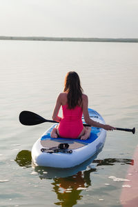 Man kayaking in lake