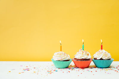 High angle view of cupcakes against white background