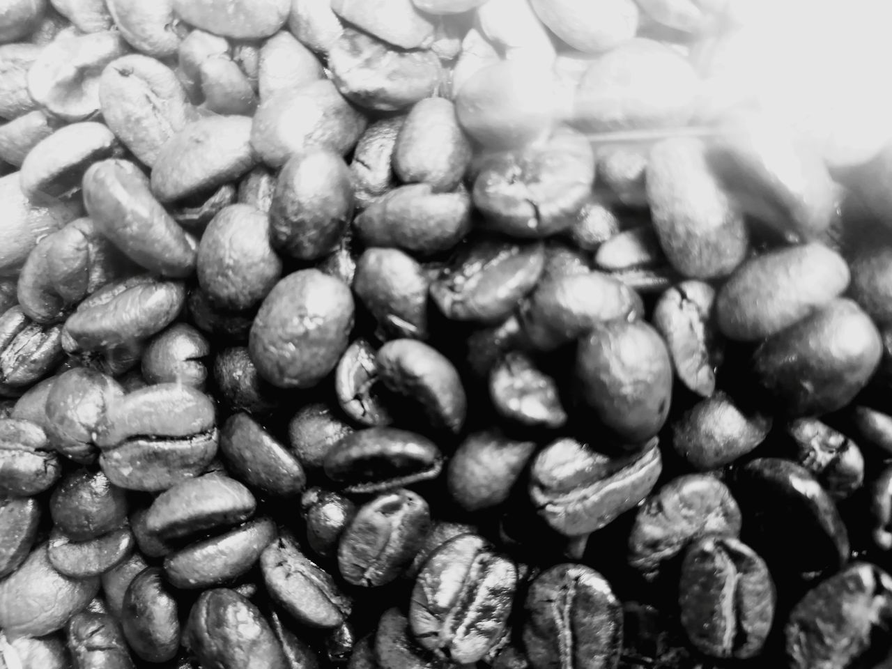 FULL FRAME SHOT OF COFFEE BEANS IN BACKGROUND