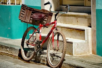 Bicycle parked on wall