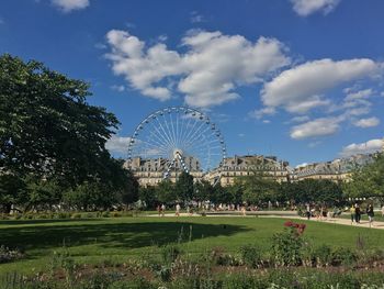 Ferris wheel in park against sky